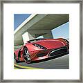 Closeup Of A Red Sports Car Driving Framed Print