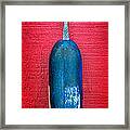 Colorful Buoy Hangs On Bright Red Wall Framed Print