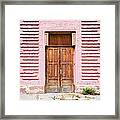 Door In A Pink Wall Framed Print