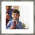 Father And Son Fixing Ties Together Framed Print