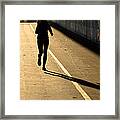 Female Jogger In Backlight Framed Print