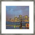 Ferry Moving Towards Lit Skyscrapers At Framed Print