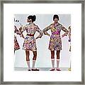 Four Models Wearing Colorful Print Dresses Framed Print