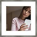 Frustrated Mixed Race Woman Texting On Cell Phone Framed Print