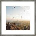 Hot Air Balloons Rise Above Desert Framed Print