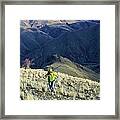 Hunter Climbing Steep Hillside Framed Print
