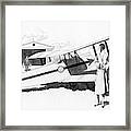 Illustration Of A Woman Standing Next To A Biplane Framed Print
