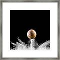Impact And Rebound Of A Ball Of Basketball On A Surface Of Land And Powder On A Black Background Framed Print