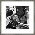 Jazz Musician Miles Davis Looking At His Trumpet Framed Print