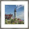 Lighthouse And Wild Roses Framed Print