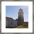 Lighthouse In The Sun Framed Print