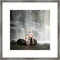 Man And Son Sitting Below Looking Glass Framed Print