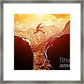 Man Jumping Over Precipice In Mountains Framed Print