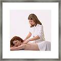 Masseuse Massages The Neck & Shoulders Of A Woman Framed Print
