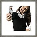 Medium Shot Of A Young Adult Female As She Playfully Poses For Her Camera Phone Framed Print