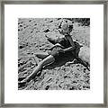 Model Covering Her Face With Hat On Beach Framed Print