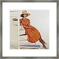 Model Sitting On A Spiral Staircase Framed Print