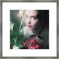 Model With Flowers Behind Wet Window Framed Print