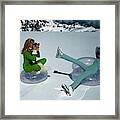 Models On Plastic Chairs With Snow In Switzerland Framed Print