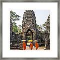 Monks With Umbrella Walking Into Angkor Wat Temple - Cambodia Framed Print
