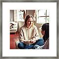 Mother And Daughter Having A Talk. Framed Print