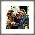 Mother And Daughters Embracing Outdoors Framed Print
