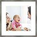 Mother Father And Baby Child On A White Bed Framed Print