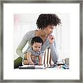 Mother Holding Baby Son Worrying About Laptop Framed Print