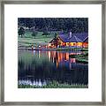 Mountain Lodge Reflecting In Lake At Framed Print