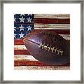 Old Football On American Flag Framed Print