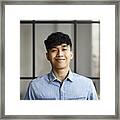 Portrait Of A Young Malay Man In A Modern Office Framed Print