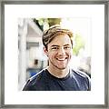 Portrait Of Smiling Young Man In City On Sunny Day Framed Print