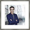 Portrait Of Stylish Businessman With Stubble Wearing Blue Suit And Glasses Framed Print