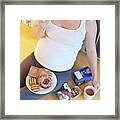 Pregnant Woman Eating Biscuit Framed Print