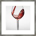 Red Wine Being Poured Into A Glass Framed Print