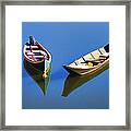 Reflections Of Two Canoes Framed Print