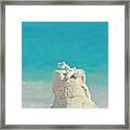 Sand Castle With Coral Against Calm Turquoise Sea 2 Framed Print