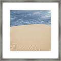 Sand Dunes And Dark Clouds Framed Print