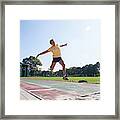 Senior Athlete (75) Practicing Long Jump Framed Print