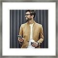 Smiling Businessman With Smart Phone And Cup Framed Print
