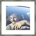 Smiling Young Man Driving Car Framed Print