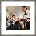 Stewardess Handing Champagne To Man Framed Print