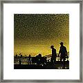 Sunset Silhouette Of People At The Beach Framed Print