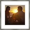 Teenage Couple (15-19) Sitting Face To Face On Beach, Sunset Framed Print