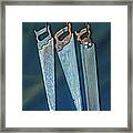 Three Hanging Saws Framed Print