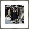 Traditional Wooden Houses In A Town Framed Print