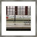 Trains At A Railroad Station Platform Framed Print