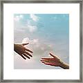Two Hands Seem To Reach Together In The Sky Framed Print