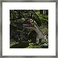 Utahraptor In A Prehistoric Forest Framed Print