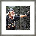 Vietnam Veteran Pays Respect To Fallen Soldiers At The Vietnam War Memorial Framed Print